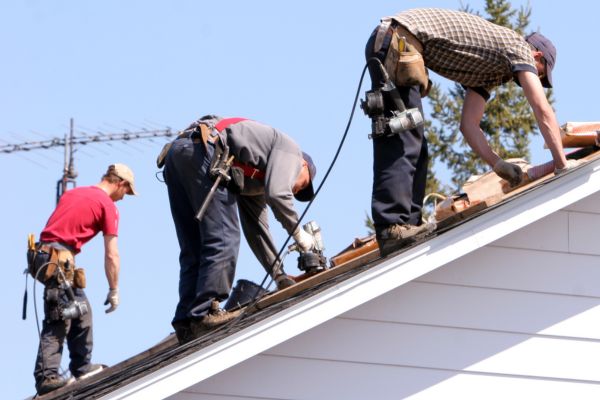 Three People Working On A Roof Restoration Project