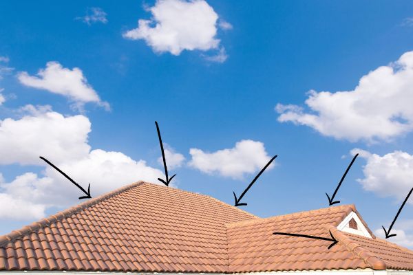 Tiled Roof With Arrows Pointing To The Ridge Capping